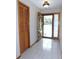 Bright entryway featuring neutral tile flooring, wood accents, and a view of the outdoors at 2865 Se 37Th St, Ocala, FL 34471