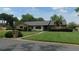 Charming home with well-manicured front lawn, brick mailbox, and neatly trimmed hedges at 2865 Se 37Th St, Ocala, FL 34471