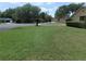 Lush front lawn, mature tree, and green landscaping enhance the curb appeal of this home at 2865 Se 37Th St, Ocala, FL 34471