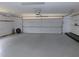 Spacious two-car garage with an automatic door and ample storage space at 2865 Se 37Th St, Ocala, FL 34471