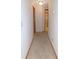 Neutral hallway leading to various rooms, adding depth to the interior space at 2865 Se 37Th St, Ocala, FL 34471