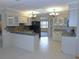 Modern kitchen with white cabinets, granite countertops, and stainless steel appliances at 2865 Se 37Th St, Ocala, FL 34471