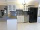 Stylish kitchen with white cabinetry, tile backsplash, and stainless steel appliances at 2865 Se 37Th St, Ocala, FL 34471
