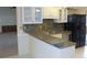 Bright kitchen with stainless steel appliances, tiled backsplash, and breakfast bar at 2865 Se 37Th St, Ocala, FL 34471