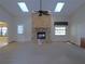 Bright living room featuring a brick fireplace, skylights, and a ceiling fan at 2865 Se 37Th St, Ocala, FL 34471