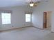 Main bedroom with neutral carpet and windows at 2865 Se 37Th St, Ocala, FL 34471