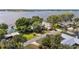 Aerial view of charming home on a waterfront lot at 31 Se Chinica Dr, Summerfield, FL 34491