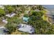 Stunning view of waterfront community with mature trees and lake access at 31 Se Chinica Dr, Summerfield, FL 34491