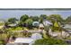 Waterfront property with lush landscaping and scenic water views at 31 Se Chinica Dr, Summerfield, FL 34491