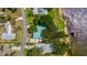 Waterfront property featuring lake access and mature landscaping in a neighborhood at 31 Se Chinica Dr, Summerfield, FL 34491