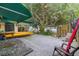 Large backyard patio with plenty of room for outdoor dining and enjoying views of the lake at 31 Se Chinica Dr, Summerfield, FL 34491