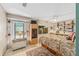 Bedroom features tile floors, bright natural lighting, wood paneled walls, and built-in shelving at 31 Se Chinica Dr, Summerfield, FL 34491