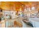 Large exercise room with hardwood floors, wood ceiling, and multiple exercise machines at 31 Se Chinica Dr, Summerfield, FL 34491