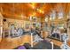 Fully equipped home gym featuring various weight machines, cardio equipment, and workout space at 31 Se Chinica Dr, Summerfield, FL 34491