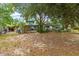 Charming two-story home with mature trees and a covered porch at 31 Se Chinica Dr, Summerfield, FL 34491