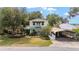 Charming two-story home with balcony, carport and front yard at 31 Se Chinica Dr, Summerfield, FL 34491