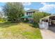 Charming two-story home featuring well-manicured lawn and covered carport at 31 Se Chinica Dr, Summerfield, FL 34491
