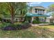 Charming two-story home with landscaped front yard and balcony at 31 Se Chinica Dr, Summerfield, FL 34491