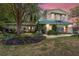Charming two-story home with landscaped front yard and balcony at 31 Se Chinica Dr, Summerfield, FL 34491