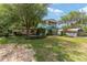 Charming two-story home with landscaped front yard and balcony at 31 Se Chinica Dr, Summerfield, FL 34491