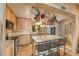 Stylish kitchen with granite countertops, stainless steel appliances, and a central island with bar seating at 31 Se Chinica Dr, Summerfield, FL 34491