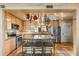 Bright kitchen with stainless steel appliances, ample counter space, and island with seating at 31 Se Chinica Dr, Summerfield, FL 34491