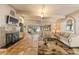 Comfortable living room with fireplace and expansive views of the water for peaceful living at 31 Se Chinica Dr, Summerfield, FL 34491