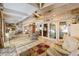Bright and spacious sunroom featuring tile flooring, paneled ceiling and plenty of natural light at 31 Se Chinica Dr, Summerfield, FL 34491