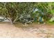 Spacious waterfront property with mature trees and manicured lawn at 31 Se Chinica Dr, Summerfield, FL 34491