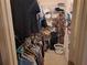 Walk-in closet providing ample storage with rods and shelving for organization at 33 Pecan Pass Trl, Ocala, FL 34472