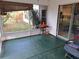 Screened-in patio with a concrete floor and sliding glass doors leading to the house at 33 Pecan Pass Trl, Ocala, FL 34472