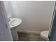 A small bathroom with light grey tile floors, and a pedestal sink at 3571 Se 37Th Ct, Ocala, FL 34480