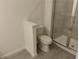 Bathroom featuring a stand up glass shower, tile floors, and modern toilet at 3571 Se 37Th Ct, Ocala, FL 34480