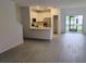 Modern kitchen featuring stainless steel appliances, white cabinetry, and quartz countertops at 3571 Se 37Th Ct, Ocala, FL 34480