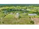 Scenic aerial perspective of the horse farm, highlighting extensive paddocks, training areas, and functional layout at 5415 Nw 100Th St, Ocala, FL 34482