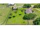 Estate property features lush green lawns, mature trees, and ample space, all enclosed by fencing at 5415 Nw 100Th St, Ocala, FL 34482