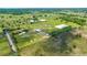 Aerial view of horse property with lush pastures, paddocks, training areas, and barns at 5415 Nw 100Th St, Ocala, FL 34482