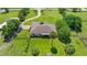Property with manicured lawn, mature trees, and fenced perimeter, and private driveway approach at 5415 Nw 100Th St, Ocala, FL 34482