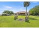 Large backyard featuring an outdoor seating area and a view of the house at 5415 Nw 100Th St, Ocala, FL 34482