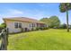 Expansive backyard featuring a covered screened-in porch and lush green grass at 5415 Nw 100Th St, Ocala, FL 34482
