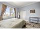 Comfortable bedroom with a queen-size bed, natural light, and ample closet space at 5415 Nw 100Th St, Ocala, FL 34482