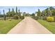 Estate home with a gated entrance and a long concrete driveway at 5415 Nw 100Th St, Ocala, FL 34482