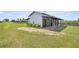 Well-maintained horse barn featuring multiple stalls and a grassy pasture area for horses to graze at 5415 Nw 100Th St, Ocala, FL 34482