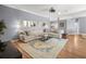 Open concept living area featuring a comfy sectional sofa and a large window at 5415 Nw 100Th St, Ocala, FL 34482