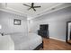 This is a light and airy main bedroom with luxury vinyl plank flooring at 5415 Nw 100Th St, Ocala, FL 34482