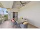 Covered patio featuring tile floors, ceiling fan and comfortable seating at 5415 Nw 100Th St, Ocala, FL 34482
