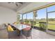 Covered patio with a ceiling fan and views of the landscaped yard at 5415 Nw 100Th St, Ocala, FL 34482