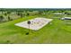 Vast riding arena with professional jumps, bordered by lush green fields and secure fencing at 5415 Nw 100Th St, Ocala, FL 34482