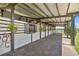 Stable interior with individual stalls and overhead coverage for horses at 5415 Nw 100Th St, Ocala, FL 34482