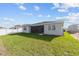 Well-manicured backyard features a screened-in lanai perfect for outdoor entertaining and relaxation at 5714 Sw 75Th Ave, Ocala, FL 34474